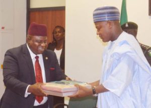 Speaker, House of Representatives, Rt. Hon. Yakubu Dogara (right) receiving the  report of  12-day Medical Outreach he sponsored in Bauchi State from the team leader of Doctors on the Move Africa, Dr. Joseph Kigbu, at the National Assembly on Wednesday 18th May, 2016.